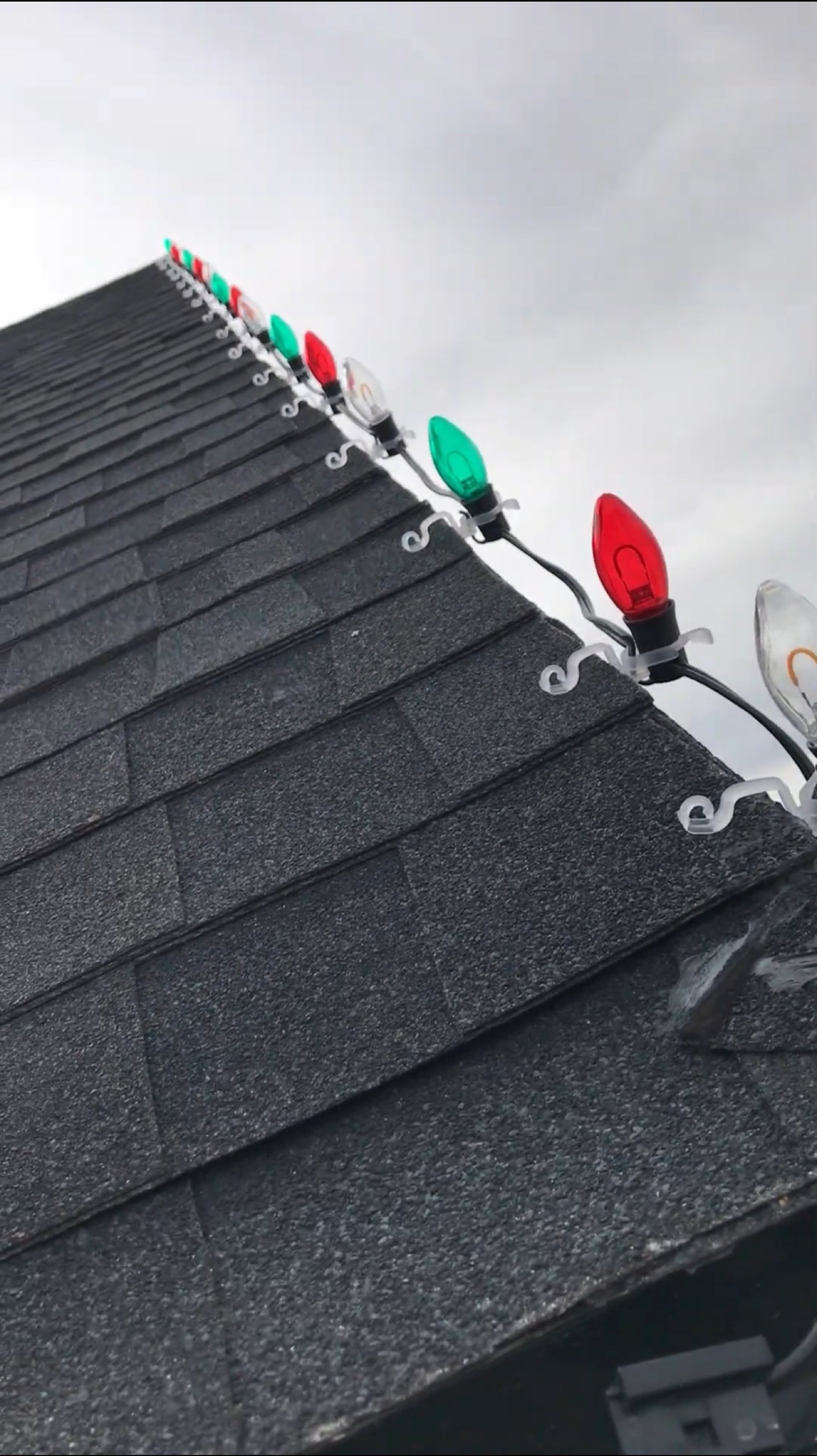 C9 bulbs clipped to the shingles